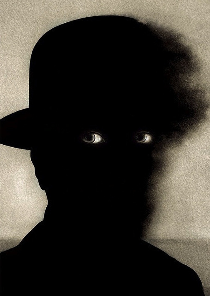 Wieslaw Rosocha. Eyes and silhouette of man wearing hat. Koncert symfoniczny, Poland, 2006.