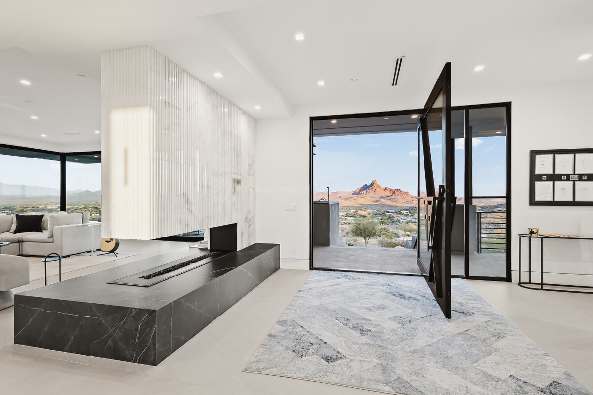 Set on 1.8 acres with 360° mountain and city views, this modern masterpiece is an architectural statement of vision and strength. See more: bit.ly/4oixVCG

Listed by Katrina Barrett with Walt Danley Local Luxury Christie's International Real Estate