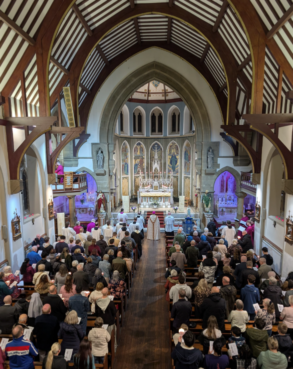 Batley Torchlight Procession. Four of our year six pupils attended the annual Batley torchlight procession earlier this week. They travelled with parishioners on the coach to Batley, prayed together, processed through Batley town centre, then they were led by Bishop Marcus Stock