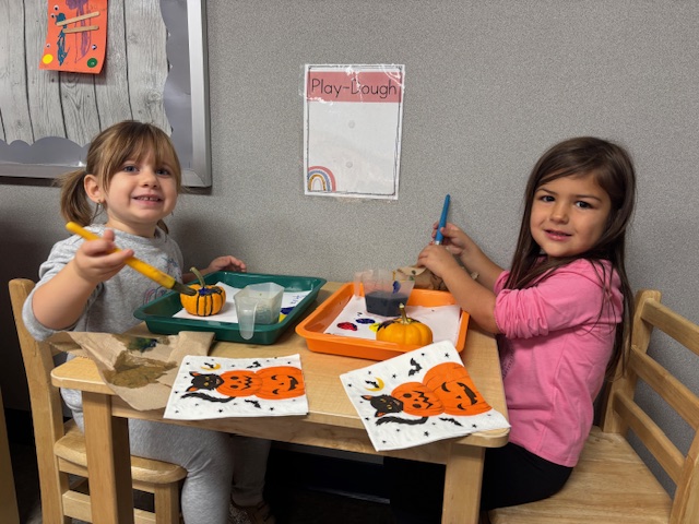 Pumpkin painting in Mrs. Cantwell's preschool class!