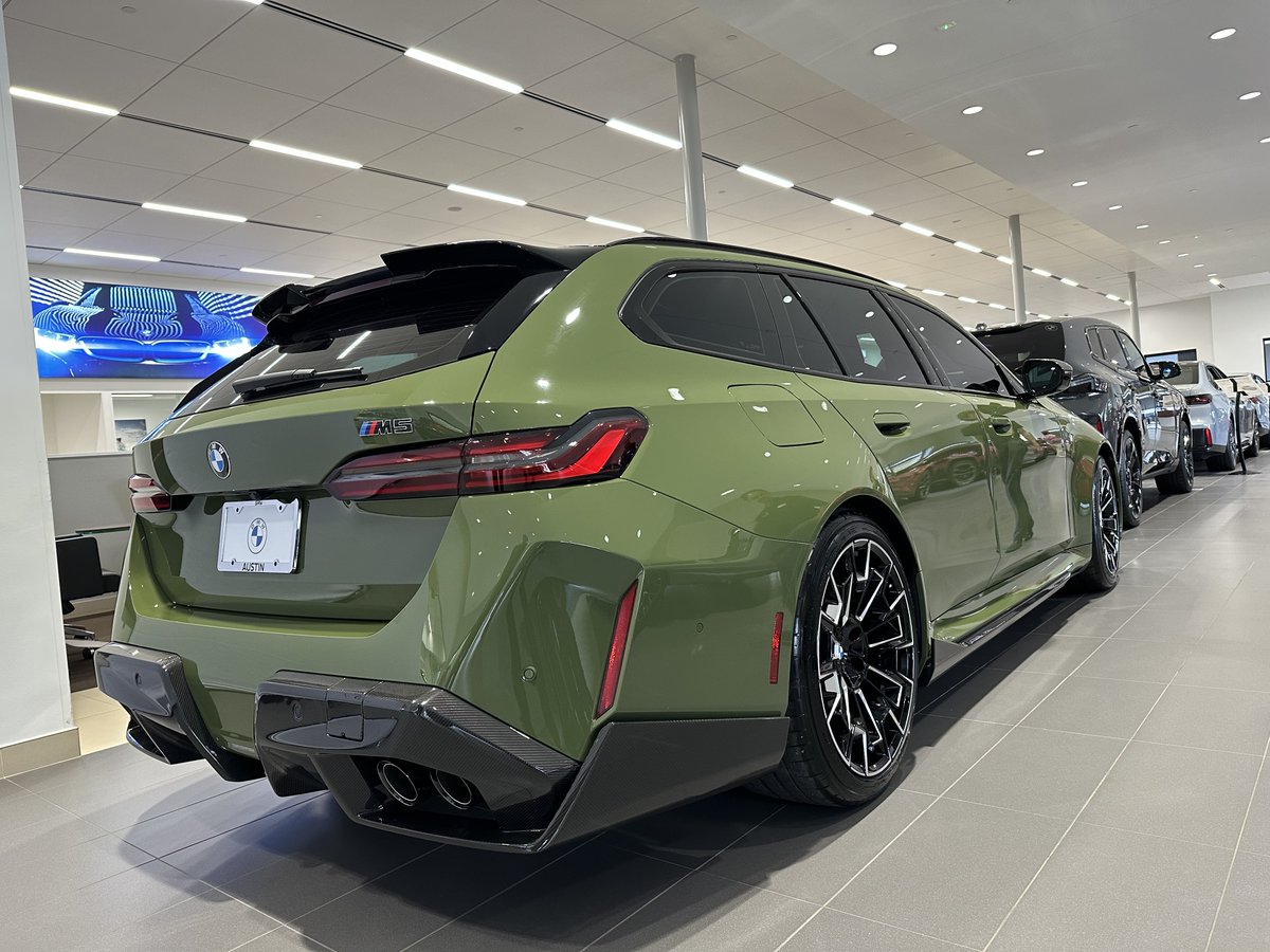 Special Order BMW M5 Touring in Urban Green with the Carbon Fiber package—rare, bold, unforgettable. #BMWAustin #BMWM5Touring