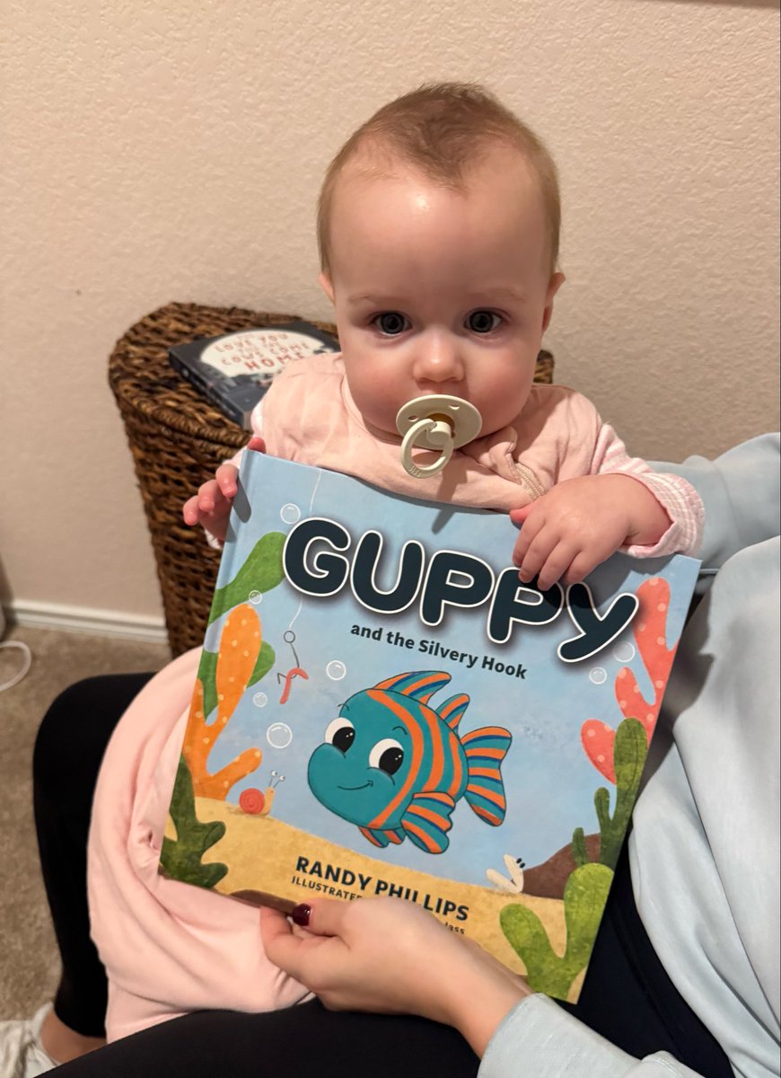 RandyPCD's tweet image. Youngest and most beautiful fan of “Guppy and the Silvery Hook.”  Baby Caroline.  Get yours today at Amazon.com