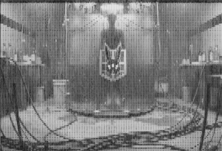 thrax_nft's tweet image. Cleaned up the images a bit
There's a figure in some chamber, in a lab maybe? 
Second device could be a Team Moth time machine - or a  microwave. I haven't the foggiest.