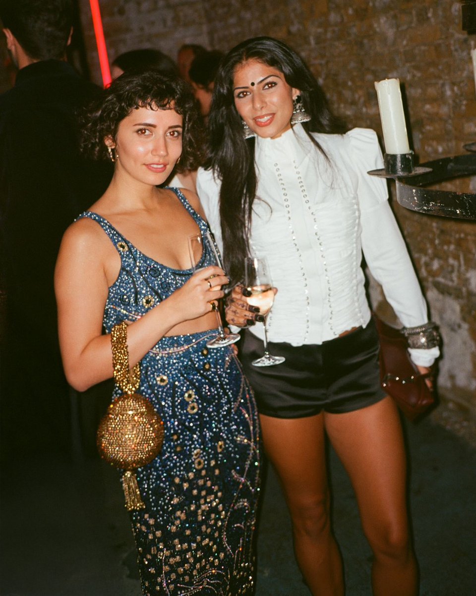 When the bag is magic ✨🪄 #OliviaDlima sparkles with our <a href="/MaeCassidy_/">Mae Cassidy</a>  Shimmering, Golden Splendor, #BabiCrystalBracelet Clutch, at the UK Premiere of #100NightsOfHero @ BFI London Film Festival afterparty 🏆 Styled by Heloise Chauviard 💫#MaeCassidy 

📷 by Julien Kalleja