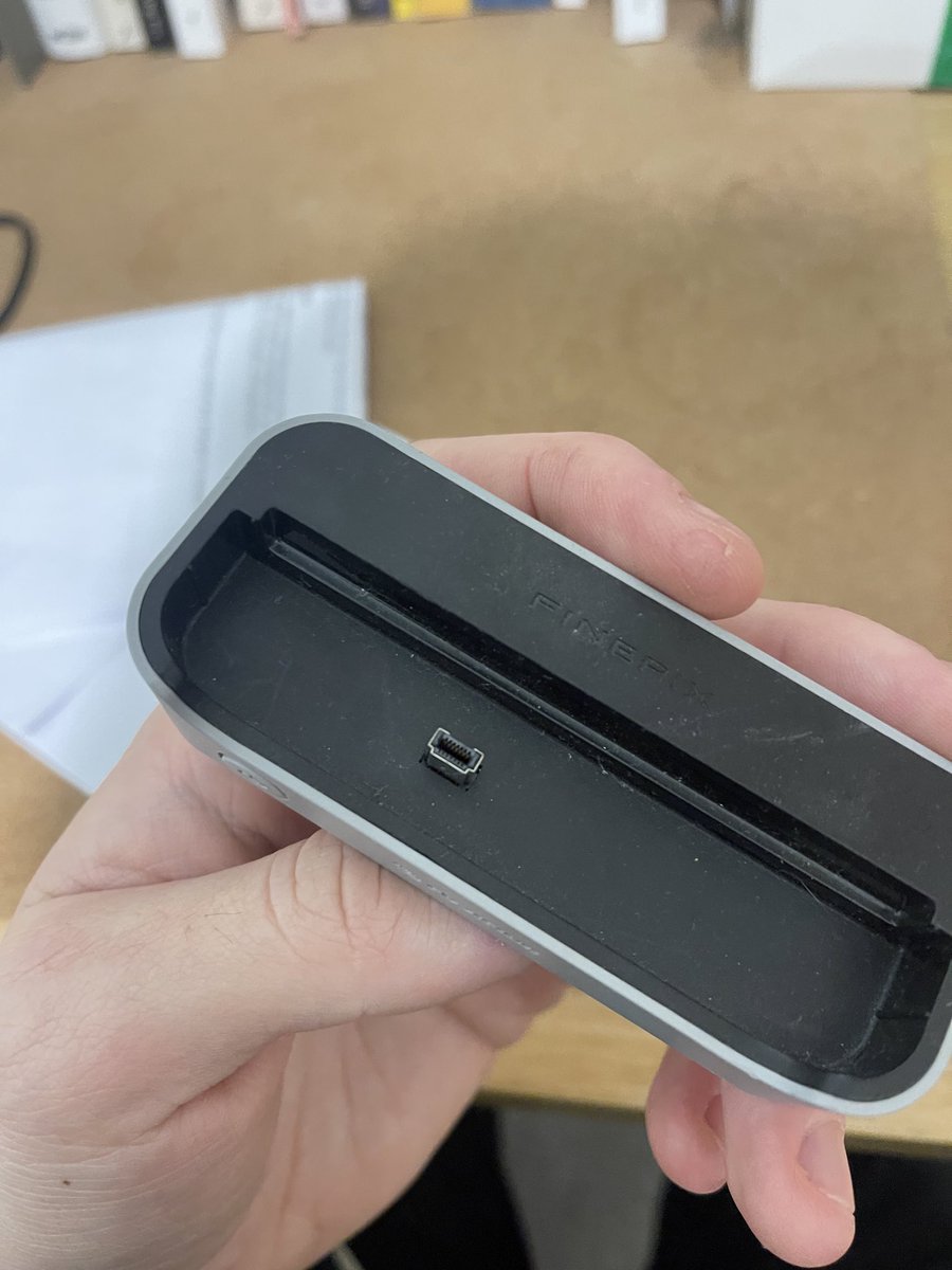 Boring question: anyone know what type of lead is needed for this camera?

Picture of dock as well which isn’t working.