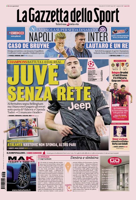 Newspaper front page titled La Gazzetta dello Sport in pink with headlines on Juventus without net in Champions League defeat by Real Madrid showing player in black and white jersey De Bruyne case for Napoli super match against Inter Lautaro as king with 11 goals Slavia survives 0-0 against Atalanta Krstovic failing Europa League Bologna Orsolini anti-Steaua Viktoria Gasp with Dybala Conference Fiorentina challenges Rapid images of players like Vlahovic in jersey Bellingham scoring Bernabeu stadium crowd Mak article on tires and other sections.