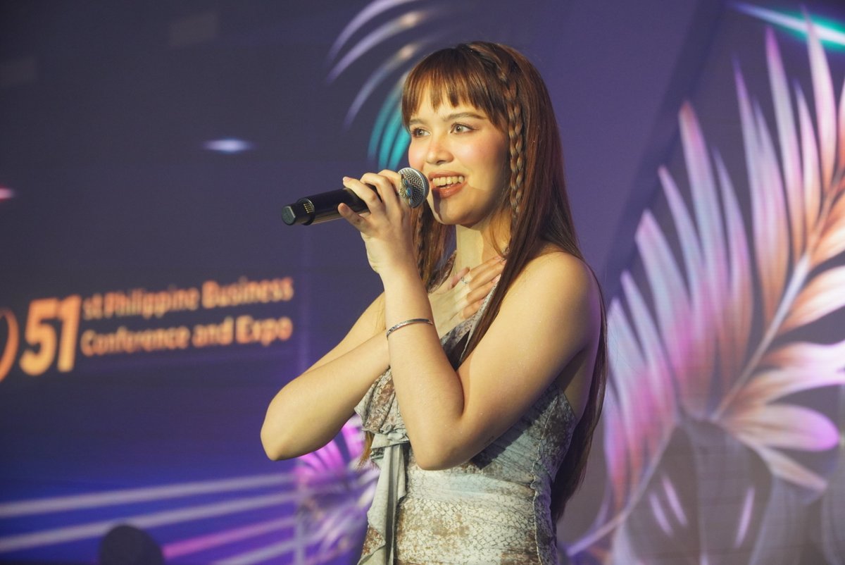 VMXGlobal's tweet photo. LOOK: VMX Princess #Ataska delights audiences with her sweet voice and endless charm at Tech Expo 2025.

#VMXGlobal https://t.co/jNkQq2MIvG