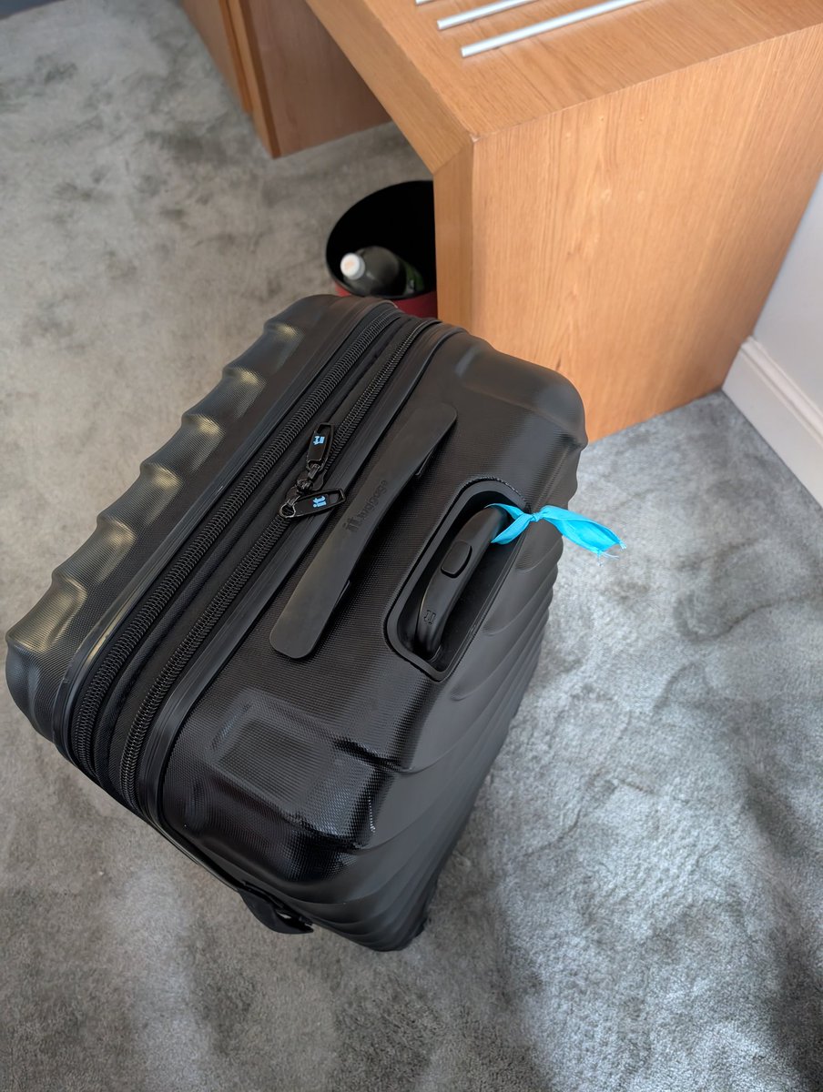 Sam48Bell's tweet image. Another use for your @bertsbooks ribbons. Husband tied one to our case for identification at the airport. He usually moans about how many ribbons I have.