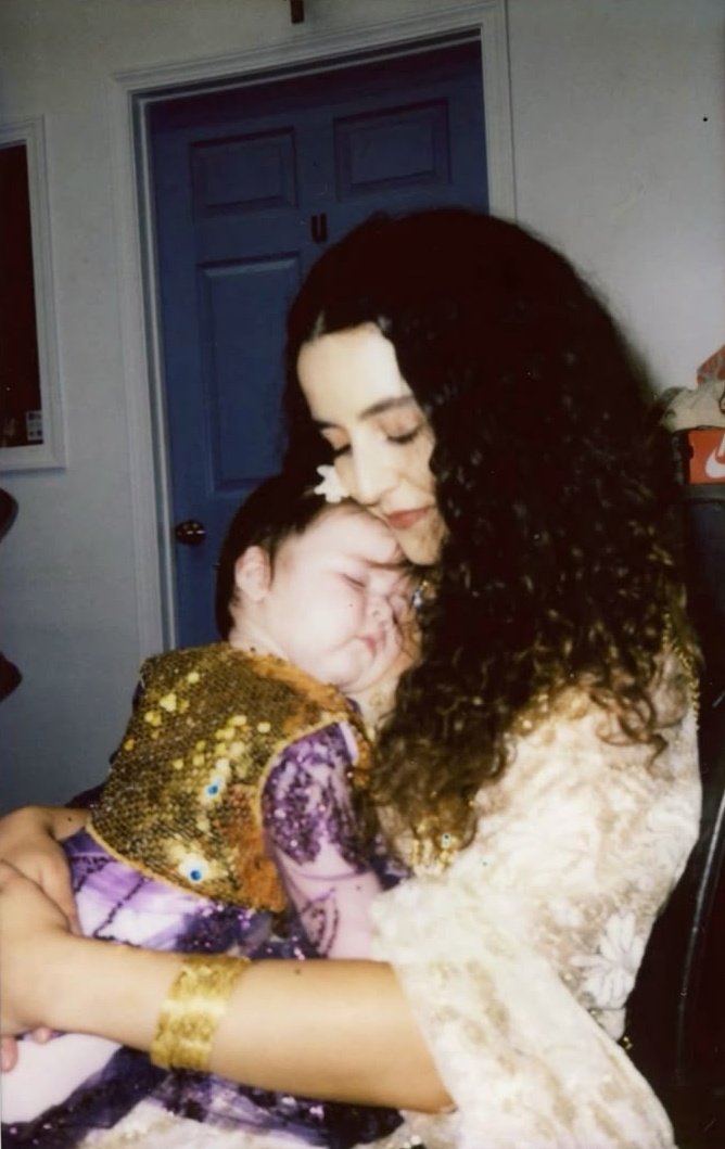 Kurdish mother with her baby in her arms, 1990s.