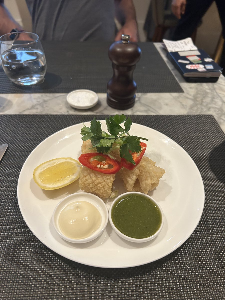 London Heathrow Qantas lounge manager got us a special order of salt and pepper squid. When he heard I had taking photos.