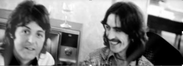 paul mccartney and george harrison just as theyre about to sign the beatles' dissolution papers, marking the official break up of the beatles. @ plaza hotel, new york city - december 19, 1974.