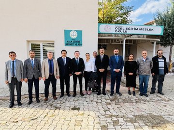 First image shows a group of about 15 professionals in suits and formal attire standing on a paved area outside a white building with green signs reading Tunceli Halk Egitimi Merkezi and Halil Rufai, under a clear sky with trees nearby. Second image depicts six men in suits seated around a black table in an indoor room with beige walls, decorative items like clocks and vases on shelves, water bottles and documents on the table. Third image features eight people including men in suits and a woman in a white top standing in a white-walled room with a clock, blue chairs, and a door. Fourth image shows ten individuals in business attire gathered in a similar indoor space with a clock, red chair, and blue sofa.