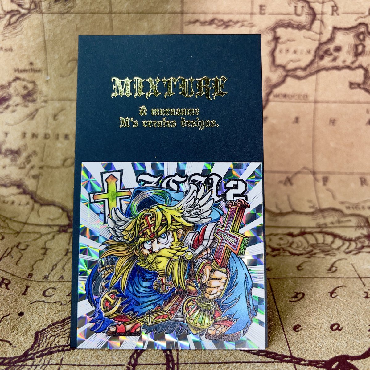 Go_Go_cook's tweet image. 【購入品紹介】
mixture様（@mixture_7 ）のシールをお迎えしました✨
ずっと気になっていた作家様の作品で、世界観や表現力が最高！

聖界の神は凸凹感のある質感で、透け感や線の抜き、集中線の効果によりプリズムの輝きが際立ち、迫力満点の仕上がりです⚡️

そして、ぽちゃナイトはただただ可愛い🩵