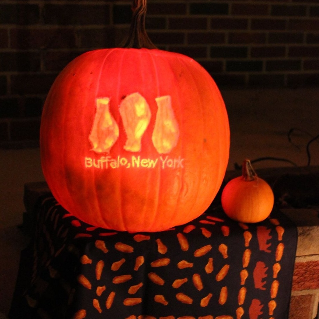 Nothing says Happy Halloween better than chicken wings carved on a pumpkin sitting on a chicken wing bandana! 🍗🎃 So artistic! That is a real carved pumpkin too, not AI 🥰👍