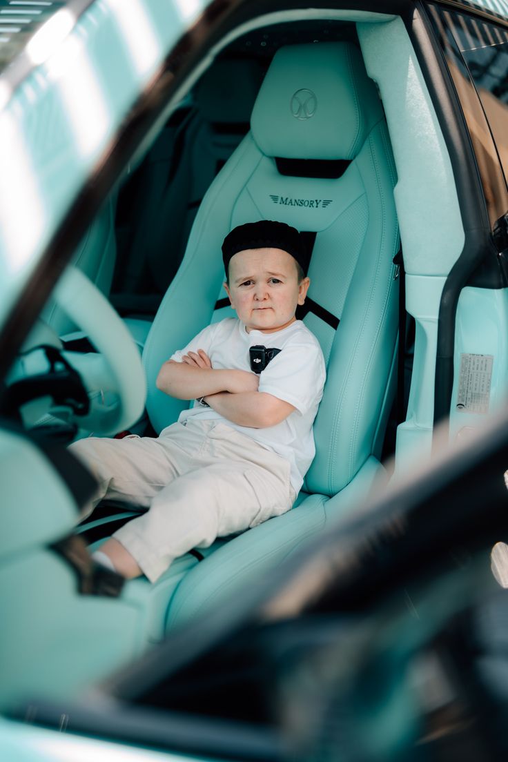 Child in luxury car looking serious, representing agreement with privacy in crypto