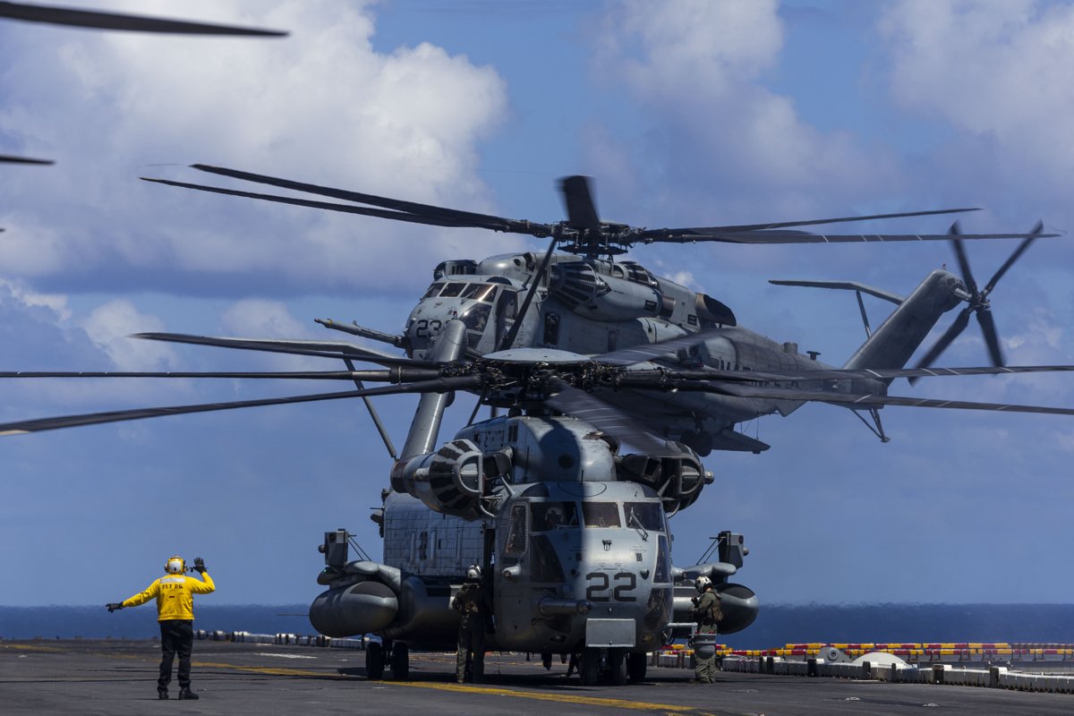 MARFORSOUTH's tweet image. Two CH-53 Super Stallions from VMM-263 (Rein.) land on the flight deck of USS Iwo Jima (LHD 7) in the Caribbean Sea as U.S. forces supported @Southcom missions and presidential priorities. #USMC #SOUTHCOM #IwoJima #VMM263 #Marines