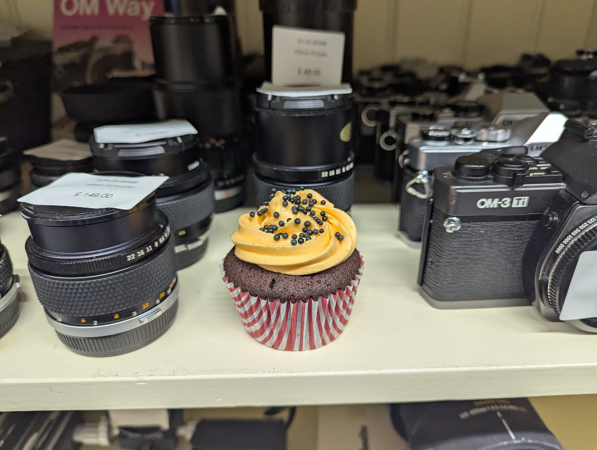 We lost a cake, found it next to the Olympus OM-3Ti