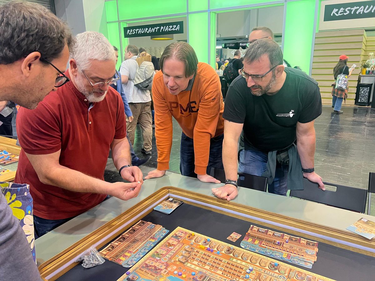 ClubDreadnought's tweet photo. La expedición del Club a Essen Spiel 2025 ha comenzado estupendamente, probando la novedad de Vital Lacerda: The Great Library, con el propio Vital como maestro. 😂
#clubdreadnought #essenspiel #essenspiel2025 #vitallacerda #thegreatlibrary #eaglegriphongames https://t.co/TJ15uBQm6e