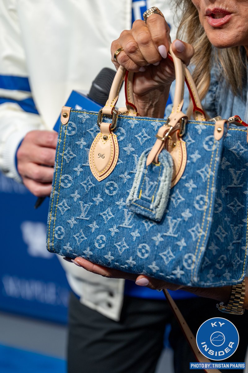 Lee Anne Pope is wearing a custom denim Louis Vuitton purse
