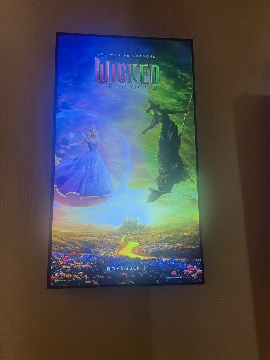 beershomesick's tweet photo. discovered a cinemark in my hotel so of course i had to take a pic with the wicked: for good poster display!! 💚🩷 
@wickedmovie @jonmchu https://t.co/FAXAhhnecX