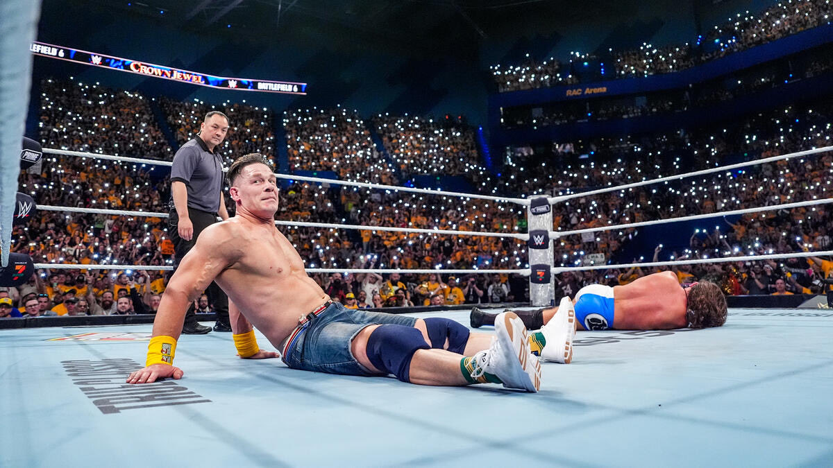 Fightful's tweet image. Incredible shot of John Cena looking at Bray Wyatt’s fireflies at WWE Crown Jewel