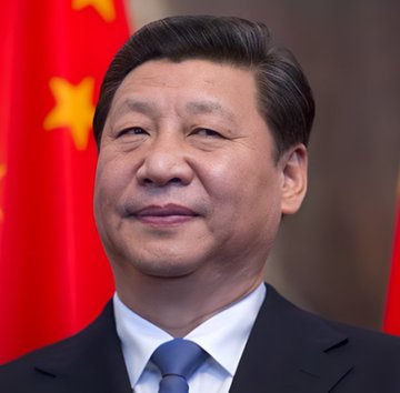 Portrait of Xi Jinping, a man with short dark hair, wearing a dark suit, white shirt, and blue tie, standing in front of two large red Chinese national flags with yellow stars. Second image shows numerous cylindrical oil barrels stacked in a pyramid formation, painted in orange, white, and green stripes with blue wheel symbols representing the Indian flag on one side, and white, blue, and red stripes with a blue stripe in the middle representing the Russian flag on the other side, set against a blue sky with a bright sun.