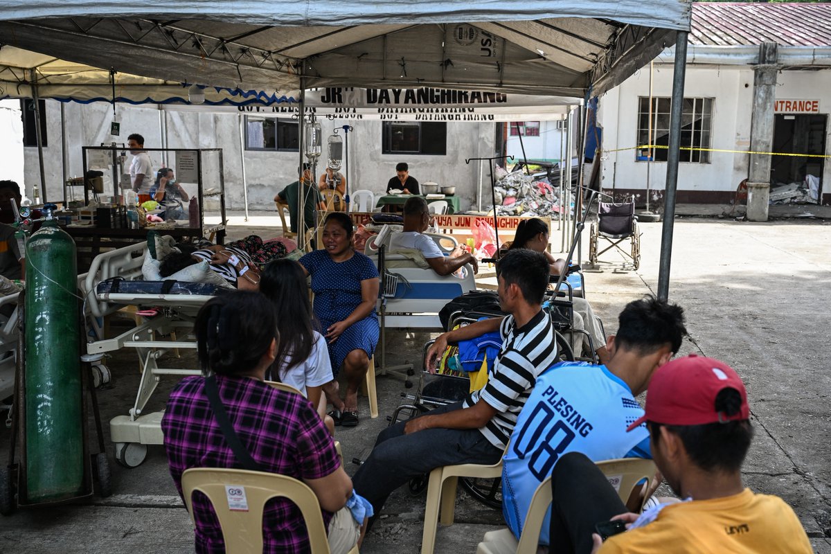 inquirerdotnet's tweet image. LOOK: Patients wait outside a damaged hospital in Manay, Davao Oriental, after two powerful earthquakes struck off the province on Friday, Oct. 10, killing at least eight people and triggering tsunami warnings that were later lifted. | 📷: Jam Sta. Rosa/AFP

•⁠ ⁠Follow live…