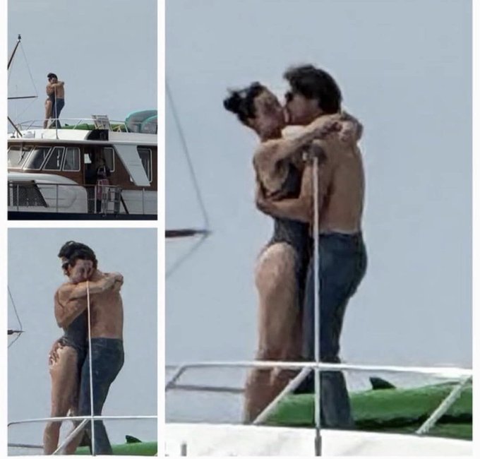 Four-panel collage depicts a couple on a yacht deck. Top left shows a man standing on the boat railing overlooking the sea. Top right captures the woman with hair in a bun kissing the shirtless man. Bottom left features the man in sunglasses hugging the woman from behind both shirtless. Bottom right shows them embracing closely with the woman in a black swimsuit and man in blue jeans near green cushions and boat equipment.