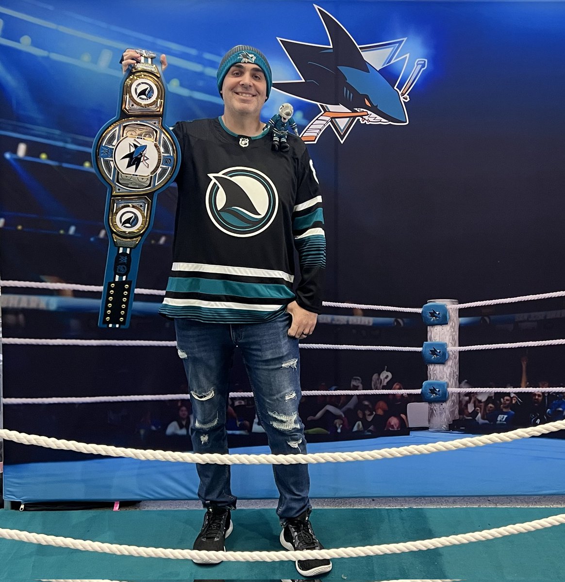sjsharkshistory's tweet photo. Not the desired outcome (maybe Jimmy Uso was right, No Yeet! lol) but it was still a fun time getting to be at the Shark Tank on #WWENight and I got to take a photo holding the #SJSharks WWE Championship, YEET! #TheFutureisTeal https://t.co/tzyRrecmlS