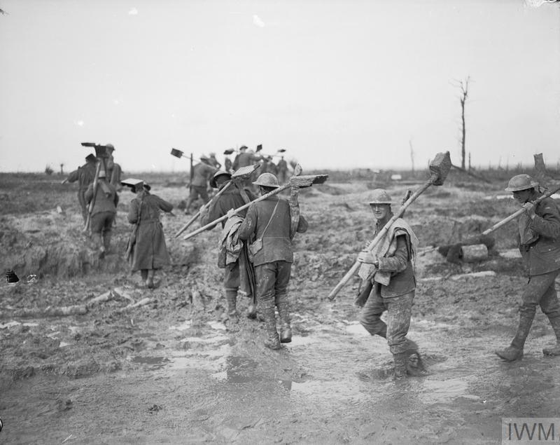 Men on fatigue duty with mud-scoops at Saint Julien, Ypres, 12 October 1917.IWMQ6056