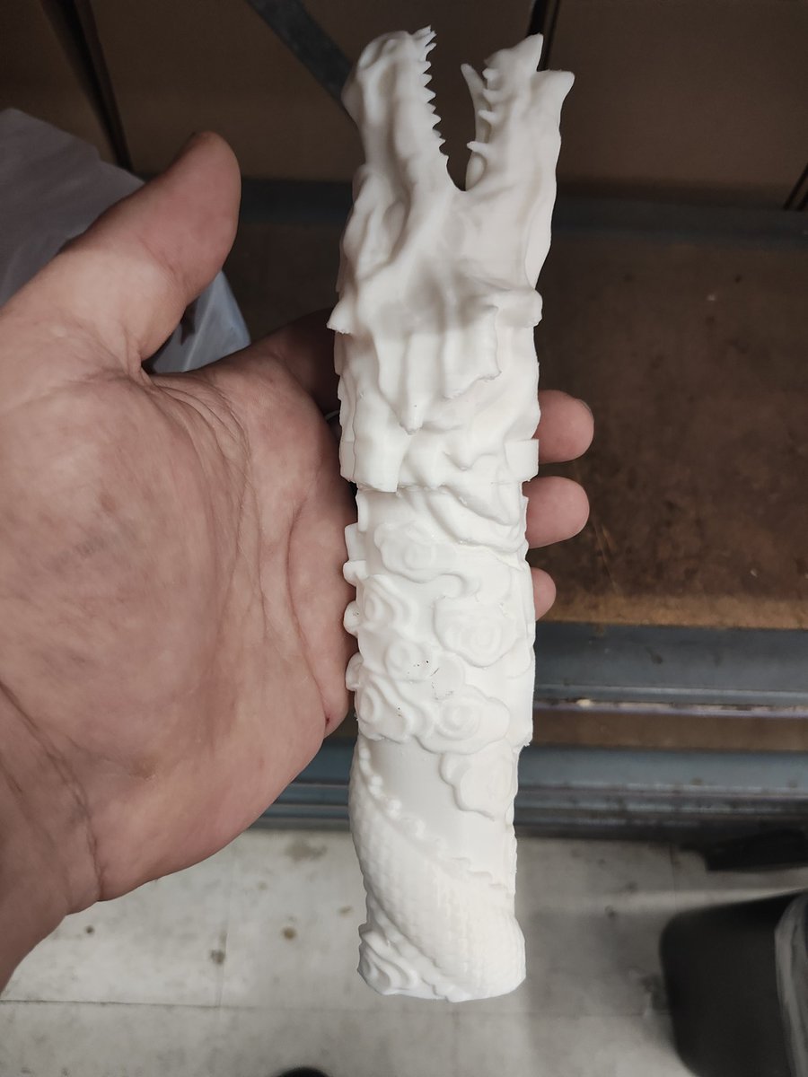 Working on a HighLander homage katana, just finished printing the handle (lower half in the pic) for the T10 carbon steel blade I received a while ago. So far I like where it's going, just need to mount it.