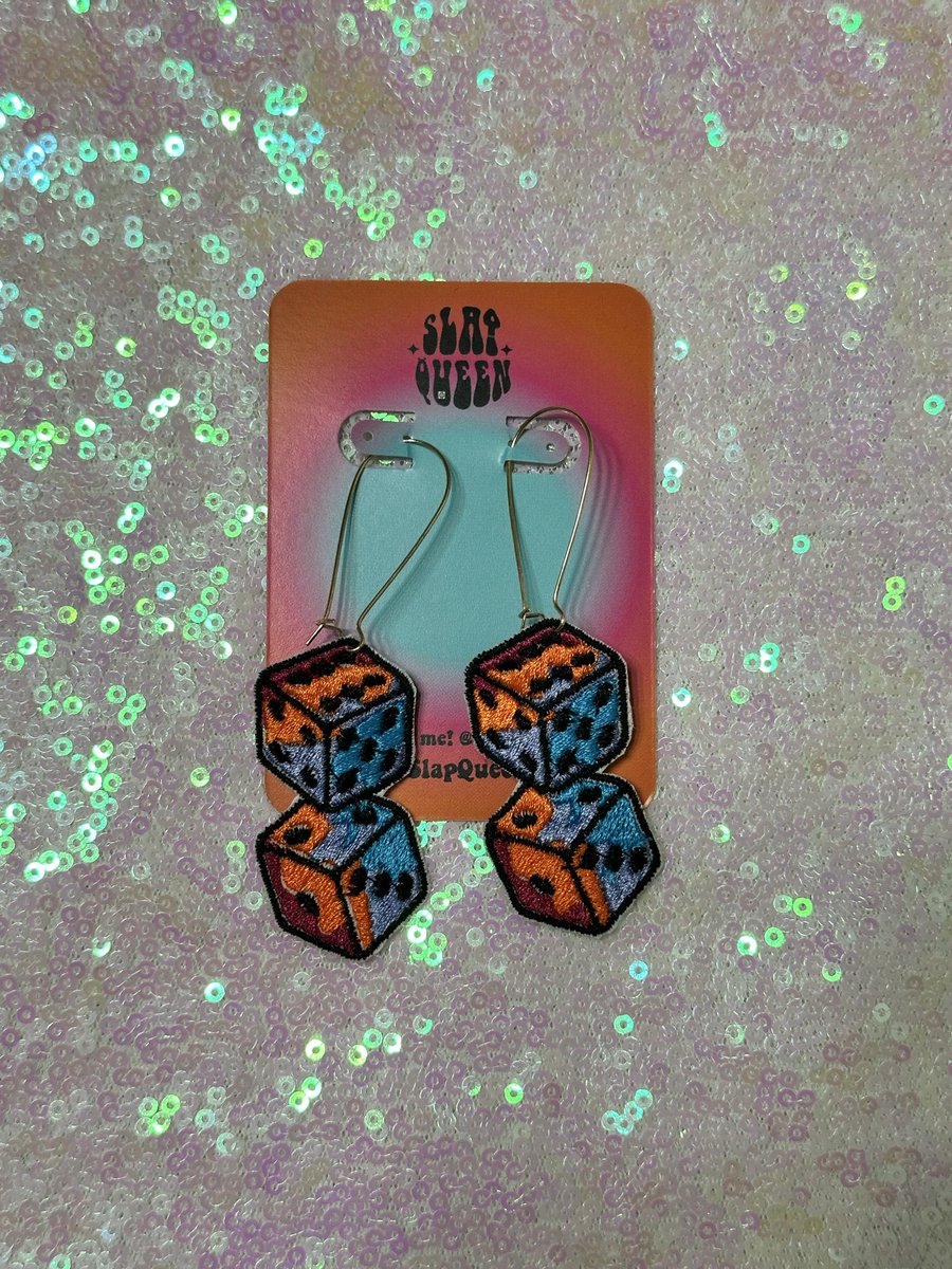 SlapQueenDotCom's tweet photo. Finally feeling like myself again after 2 years so expect more creations from me soon!! 🙏🏻

Get these trippy dice 🎲 earrings at the link in bio 💓 I will also have some earrings and patches with me at hula!! ✨ https://t.co/Rhw3fKXvMS