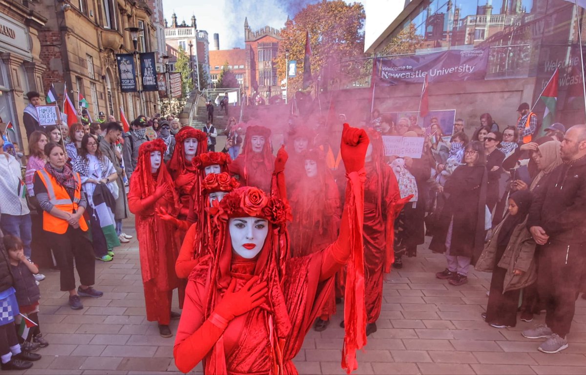 A funeral procession led by the Red Rebel Brigade in Newcastle as the performance troupe joined protesters on their march through the city centre in memory of the hundreds of thousands of Palestinian people killed in the #Gaza conflict. Pics by <a href="/WillWalkerNNP/">will  walker</a> #RedRebelBrigade