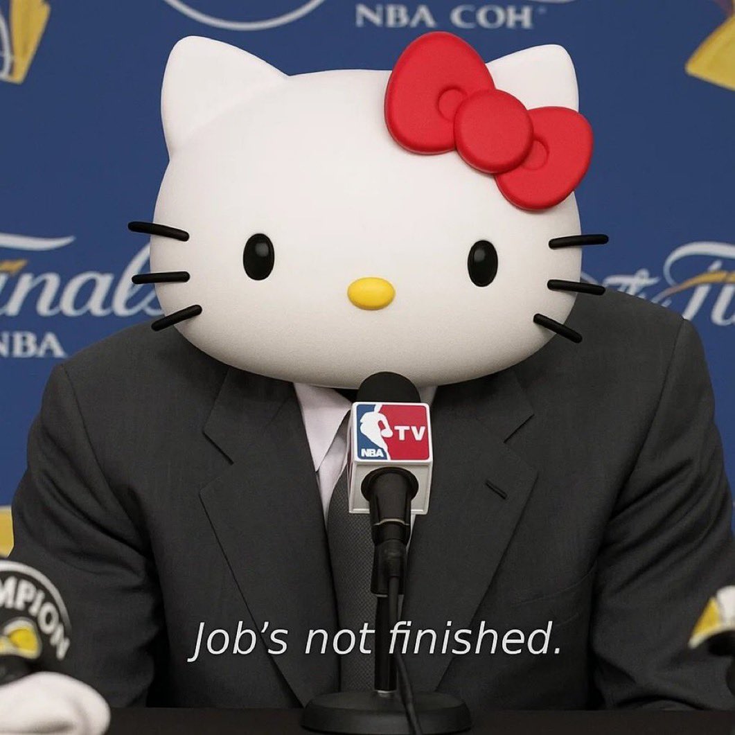 「仕事は終わっていない」というキャプション付きの、スーツ姿で記者会見に立つHello Kitty
