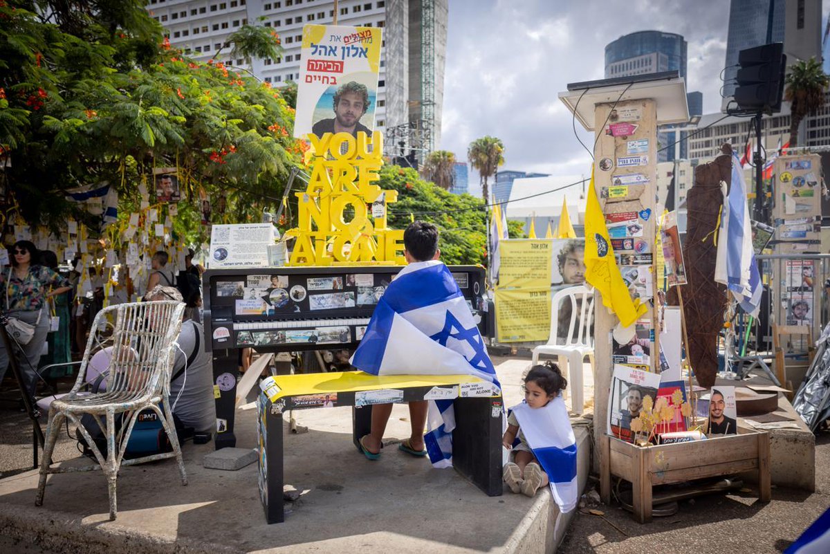 StandWithUs's tweet image. In Hostage Square, Tel Aviv, a piano stands in honor of gifted 24-year-old pianist Alon Ohel, one of 48 hostages held by Hamas in Gaza for more than two years. Israelis play it as a symbol of hope and solidarity. Alon is expected to be released within the next day. May he soon…