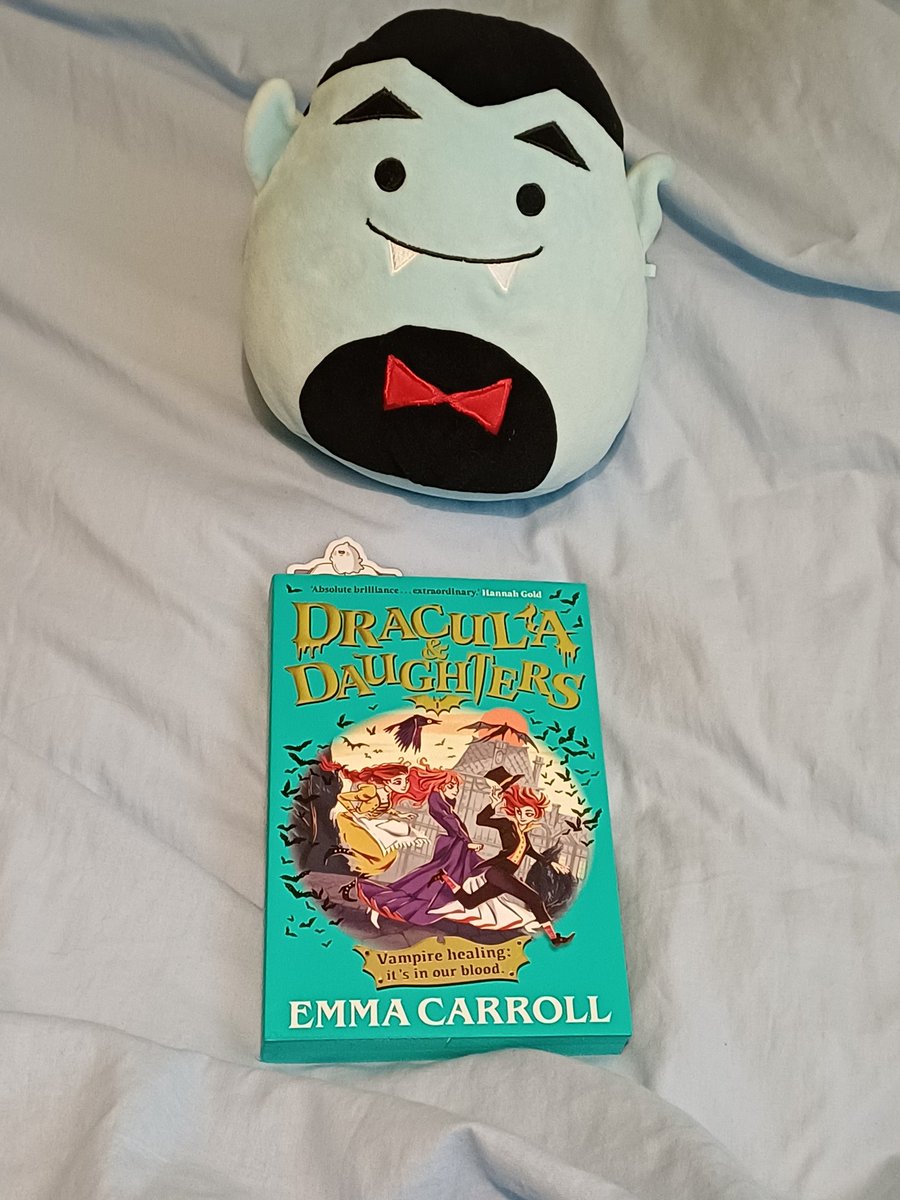 Cfpercy's tweet image. And here&apos;s Claude, my Vampire squishmallow, posing with my current read: Dracula &amp;amp; Daughters by Emma Carroll (the @Waterstones exclusive edition with these adorable bats.😊)
#amreading #spookymonth