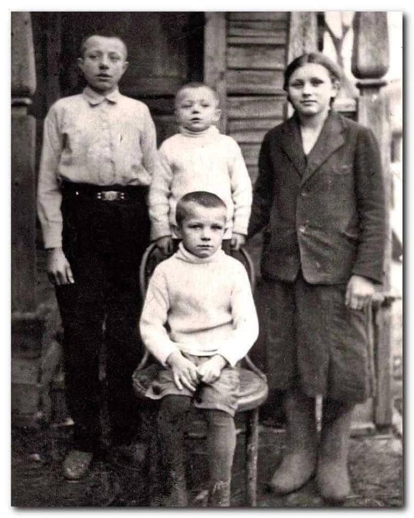 A picture of four children taken in 1938 in the village of Klushino, Smolensk region, USSR.

In 1941, the village was occupied by the Nazis, and for "fun"  a German soldier would hang the smallest child in the picture, Boris, from a tree using his own scarf. 

The boy's mother