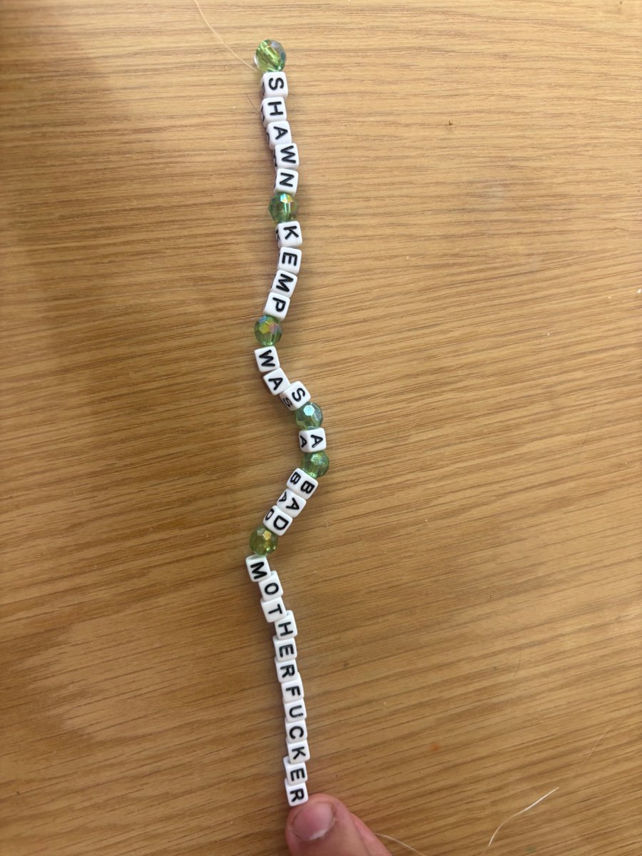 JqnaReg06's tweet photo. @SheaSerrano What is the recommended reading age for this? In an effort to keep my 10 yr old reading, I got him a copy of basketball and other things and as I thank you gift, he made me this bracelet. 😳 https://t.co/crSpYriTJI