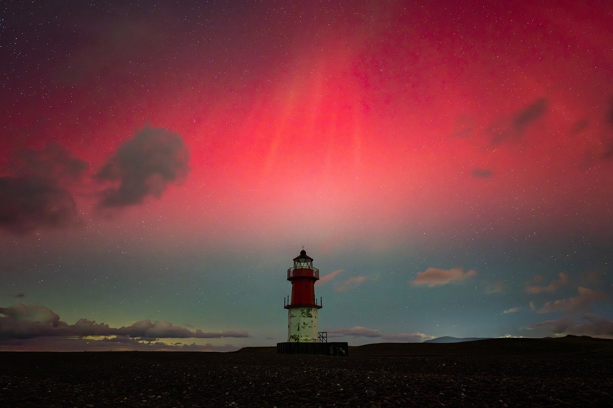 A deep red Aurora display visible to the SOUTH(!!) over Winkie lighthouse at the Point of Ayre. This shot was taken a year ago during the epic Aurora display on the 10th October 2024 - without doubt the best northern lights I’ve ever seen! 🤩 #iom #isleofman #aurora