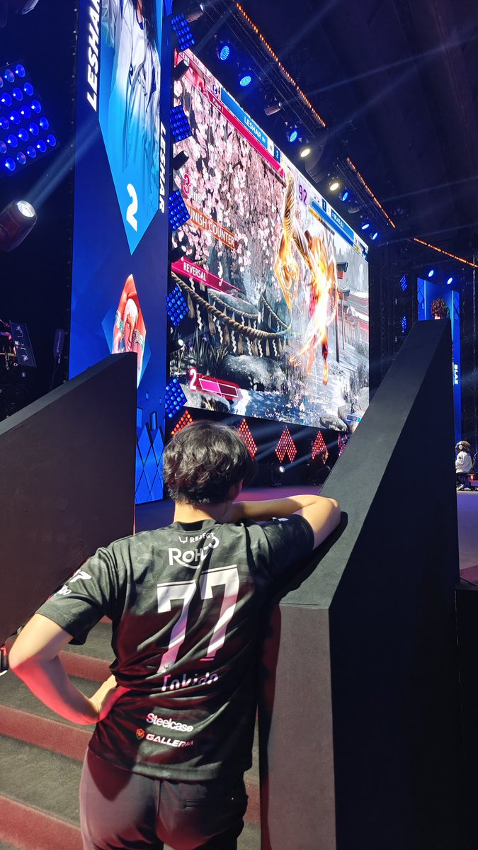 Tokido watching and cheering for Leshar like a proud father