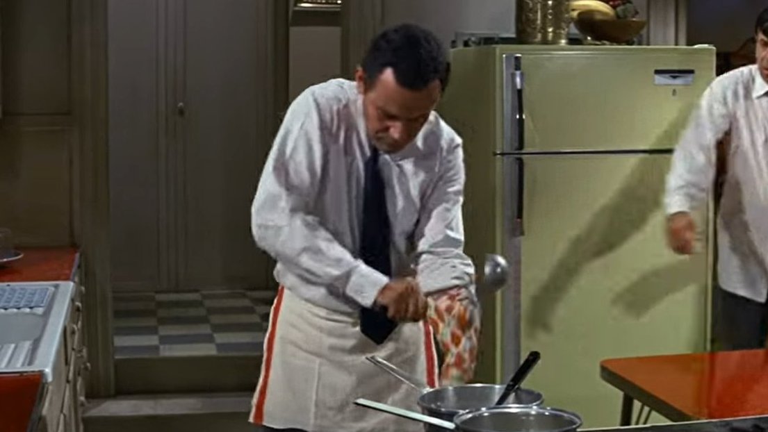 films used to have men wearing aprons while cooking