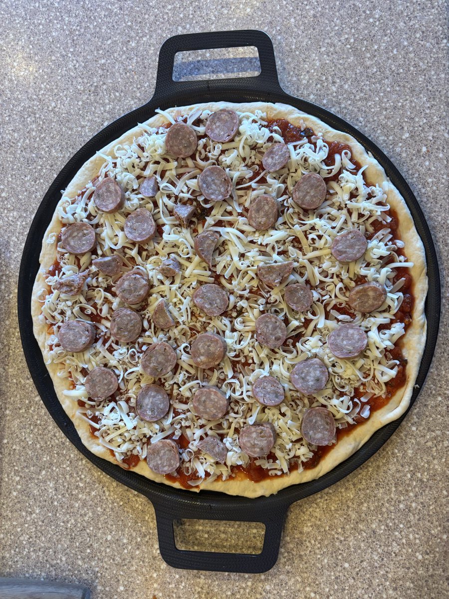 BurninTRanch's tweet image. Alyssa and I working together have created what should be the perfect pie. All from scratch (except Italian sausage). This is going to be divine. 
@alyssataylor88 That’s a full large pizza right there.