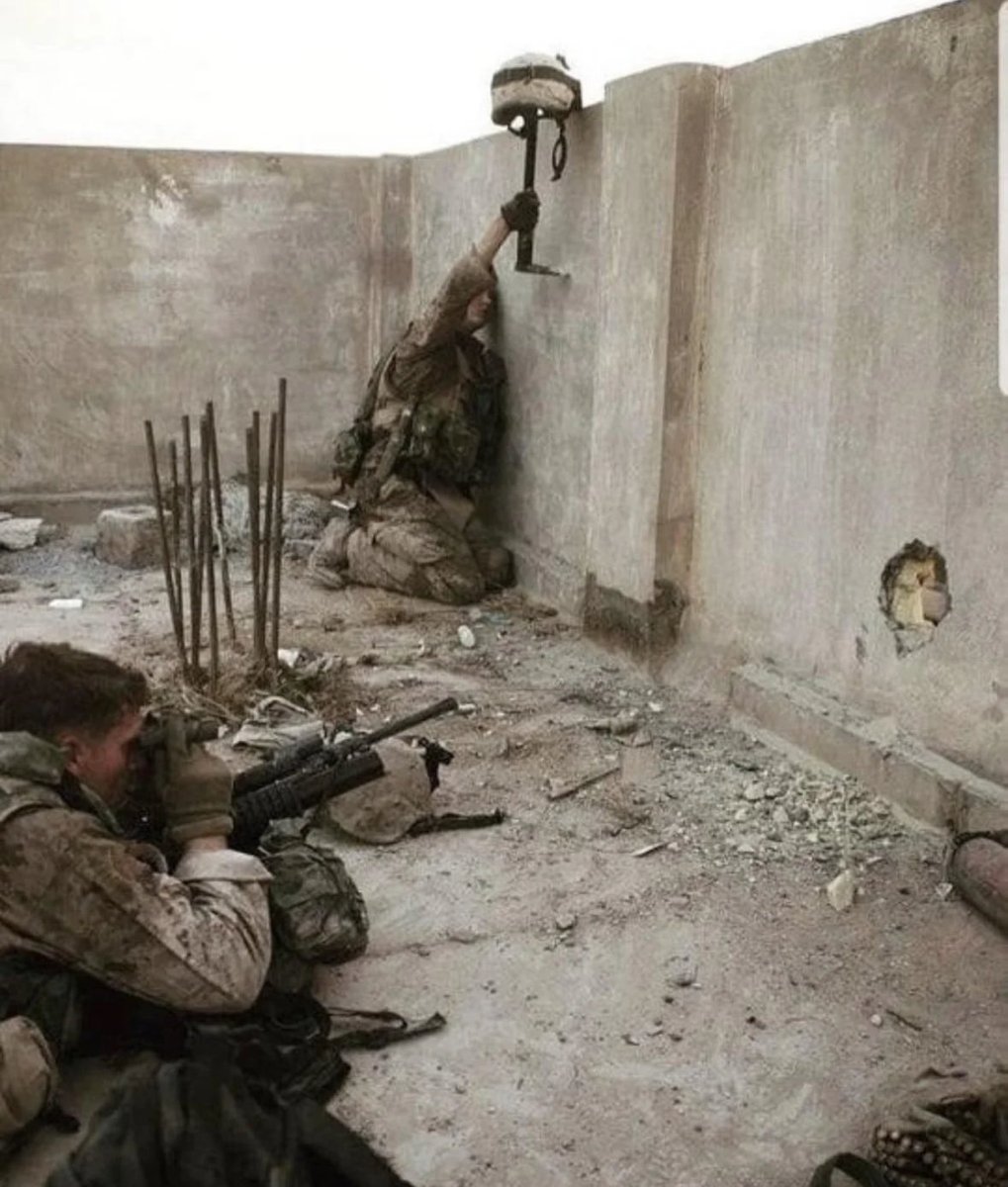 historyslides's tweet image. American Marine using his helmet as a decoy to locate an Iraqi sniper. 2003.
