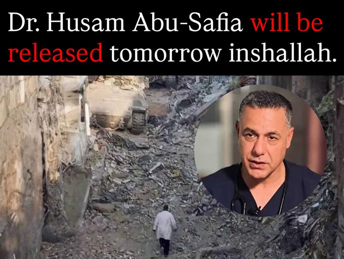 Rubble-strewn urban street scene with destroyed buildings and debris piles in the background. Heavy construction equipment like a bulldozer is visible amid the wreckage. A circular portrait overlay shows a middle-aged man with short dark hair and a serious expression, wearing blue medical scrubs and a stethoscope. A solitary figure in a white coat walks away down the debris-covered path. Text overlay reads Dr. Hussam Abu-Safia will be released tomorrow inshallah.