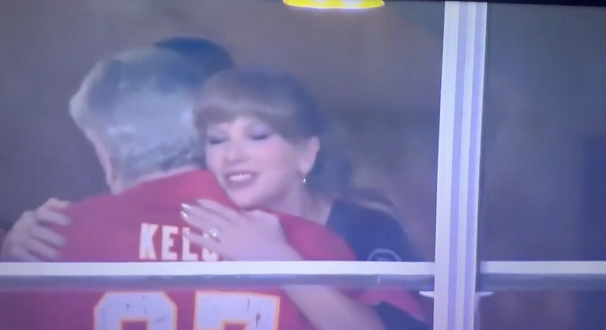 dontblamebritt's tweet image. Taylor hugging Ed Kelce in the suite
