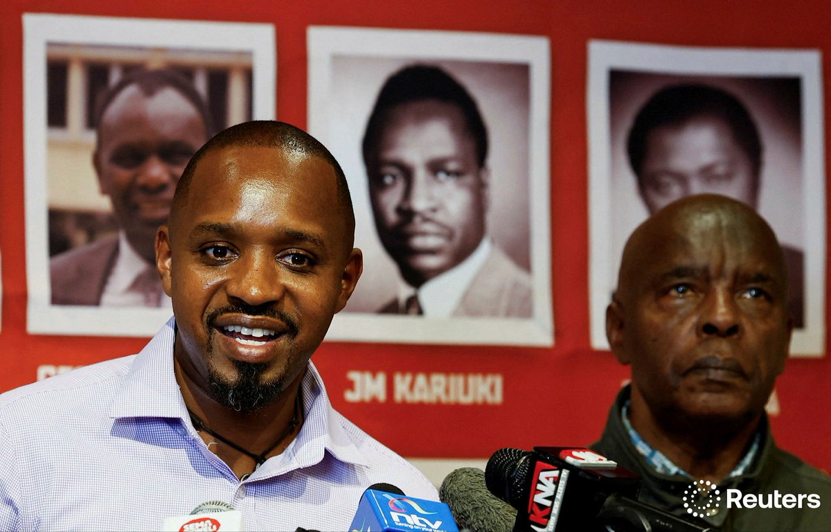 Kenyan Presidential hopeful and activist, Boniface Mwangi flanked by his lawyer Prof. Kivutha Kibwana addresses a press conference on his frequent arrest, his possible assassination and spent bullet cartridge planted in his luggage, at the Mageuzi hub in Nairobi, October 2025.