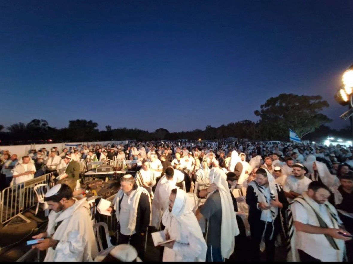 StandWithUs's tweet photo. At 6:29 a.m. (Israel time) two years ago on the Jewish holiday of Simchat Torah (October 7, 2023) Hamas terrorists launched a wave of horrific attacks on southern Israeli communities, the worst massacre of Jews since the Holocaust. 
On Simchat Torah 2025, thousands gathered at the site of the Nova Festival in southern Israel for prayers as the nation anxiously awaits the return of the 48 hostages still held in captivity since Simchat Torah 2023.🎗️🇮🇱