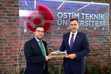 First image shows a formal auditorium with red and white decorations Turkish flags flower arrangements and a banner reading OSTİM a man in a suit stands at a podium speaking to an audience of seated attendees including some taking photos. Second image depicts a large group photo of diverse individuals in formal attire including suits traditional robes and uniforms standing in front of a red backdrop with the text 2025-2026 Akademik Yılı Açılış Töreni and the OSTİM logo. Third image features three men on stage one bald in a suit one with glasses in a suit and one in a red robe holding a blue plaque in front of a screen displaying 2025-2026 Yılı and OSTİM Teknik Üniversitesi with flower decorations and hashtag OSTİM. Fourth image shows two men in suits one holding a small model rocket on a stand in front of a brick wall with the OSTİM Teknik Üniversitesi logo and name in red letters plants visible nearby.