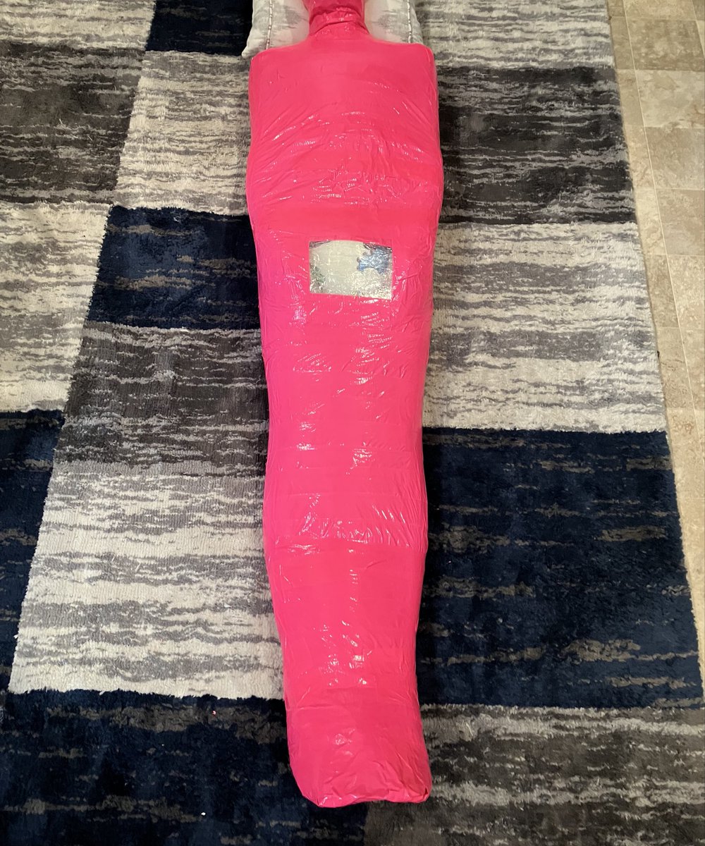 Piece by piece, layer by layer, the mummification started to take shape. 

“At least no one will be able to see that I’m wearing a diaper” 

And with that comment, Rotkapple decided to create a section out of clear packing tape, so that my diaper would remain clearly on display