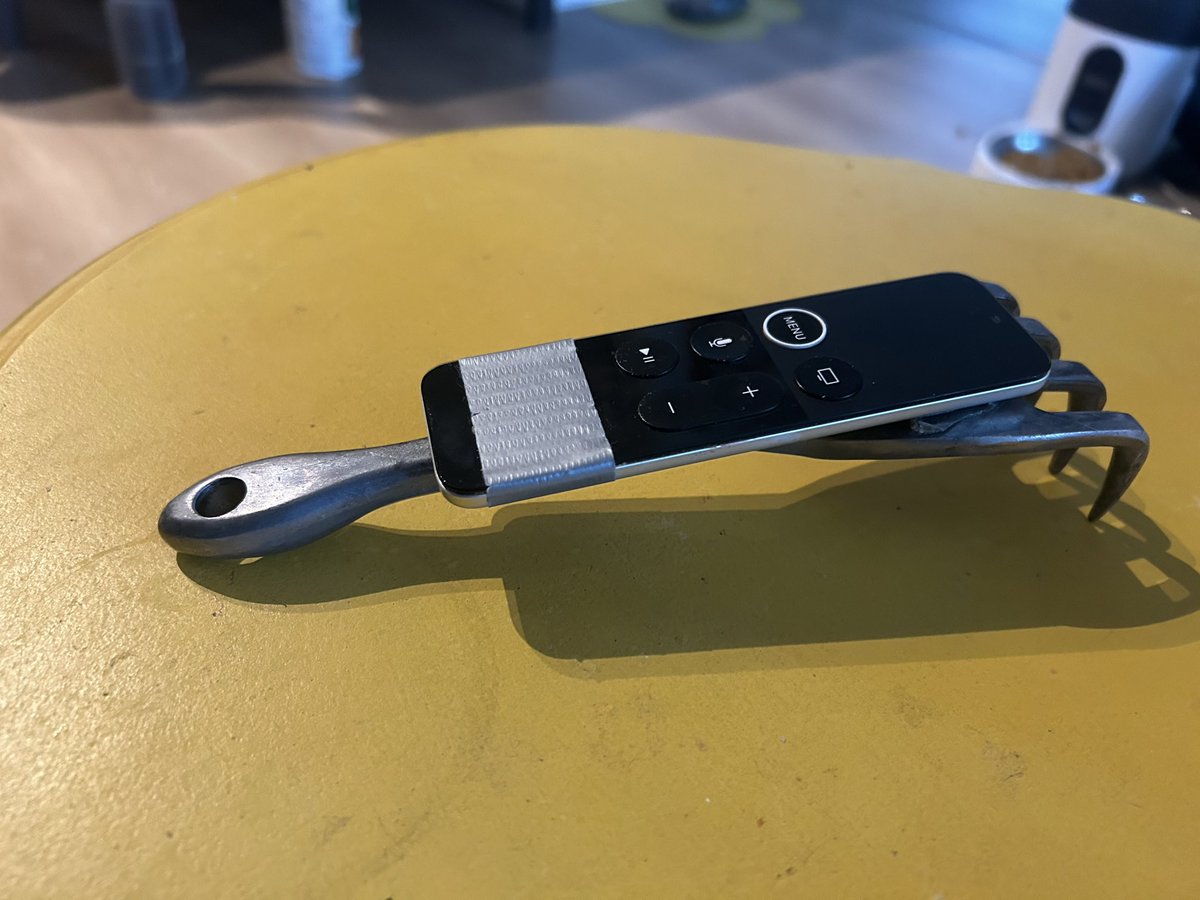 adamchenchew's tweet image. To date, this is one of my greatest inventions.
I would lose my tiny Apple TV remote daily.
So duck taped my apple remote to metal hand rake.
It coincidentally shapes to my hand really well - and most importantly, we never lose it anymore.
It also casts a pretty spooky…